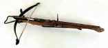 Carved medieval crossbow with bolts